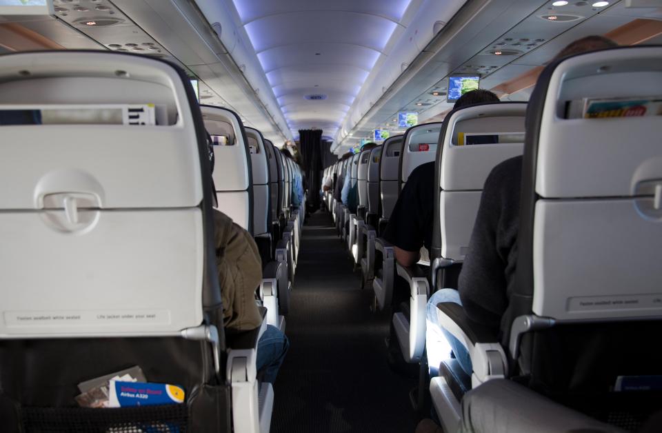 A passenger was left "humiliated" after being forced to give up a legroom seat for a couple