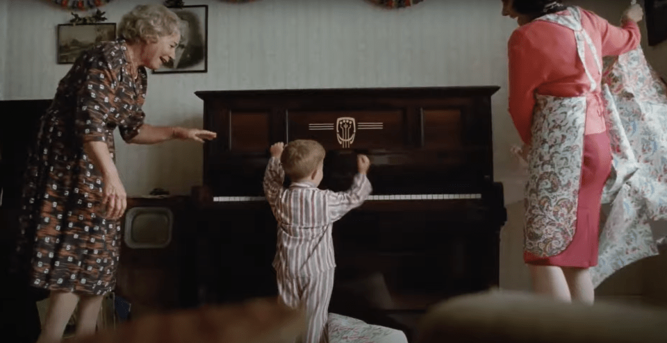 In the tear-jerking video they recreated Sir Elton opening his first piano for Christmas