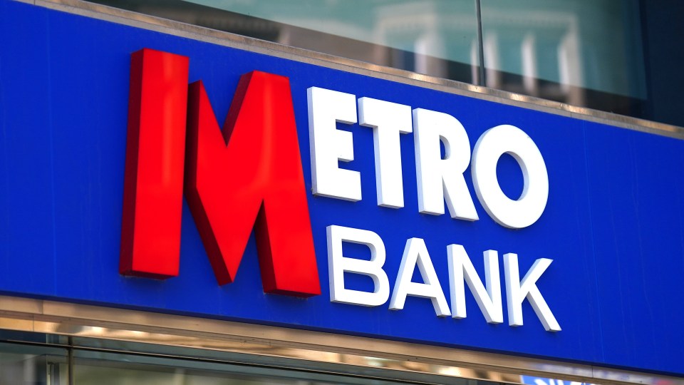 a metro bank sign that is blue and red