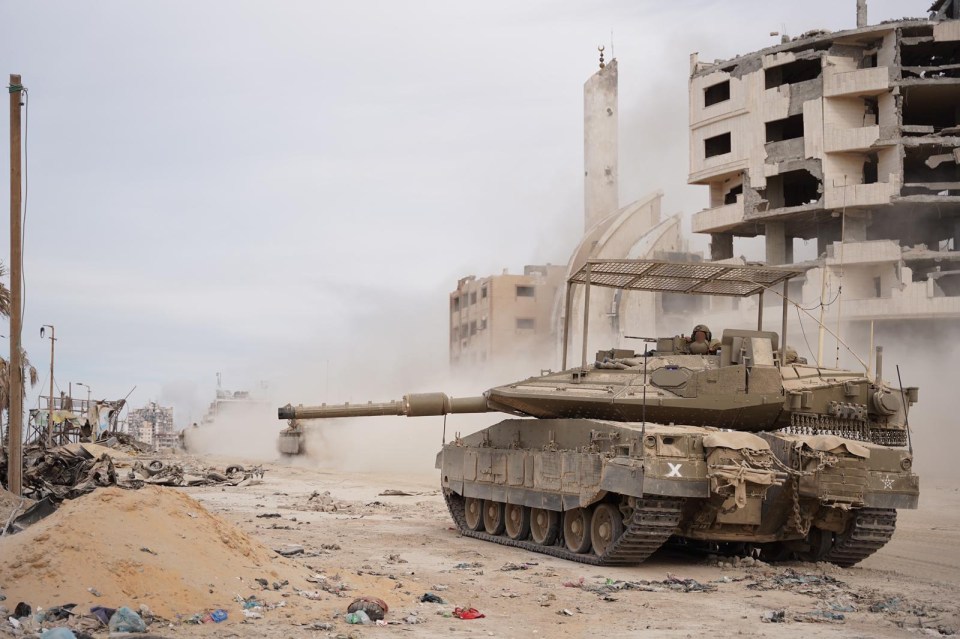 IDF troops and tanks have surrounded Gaza's main hospital Al Shifa where they believe Hamas terrorists are hiding underneath in tunnels