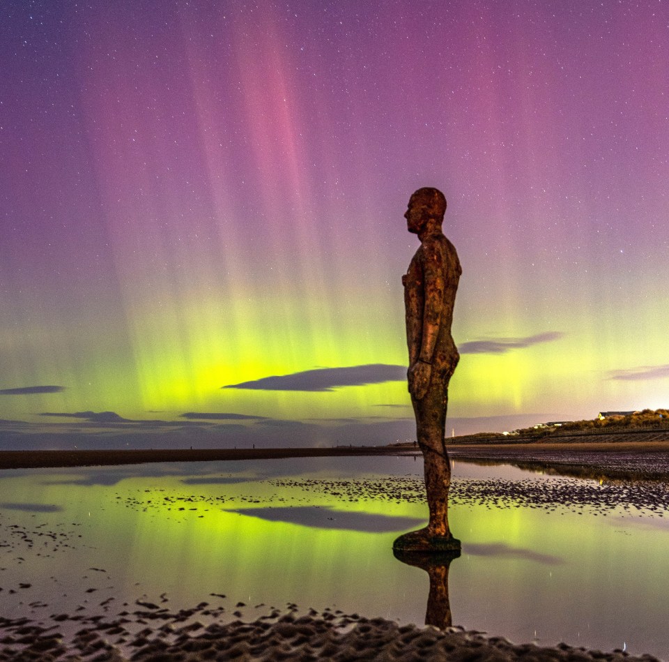 The Northern Lights at Crosby Beach on the Merseyside coastline, north of Liverpool