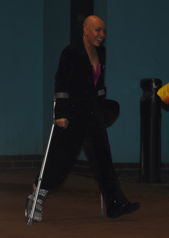 The pro dancer was all smiles as she added some glitter to her plastic walking aid