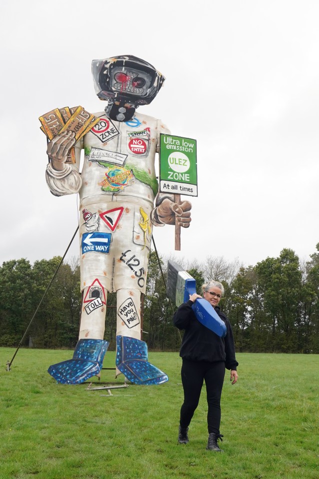 Artist Andrea Deans puts the finishing touches to the Edenbridge Bonfire Society’s latest celebrity guy - an effigy of the London Mayor brandishing cash