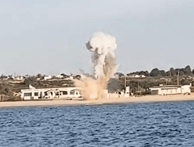 An explosion on a beach in Israel - possibly as part of the Navy's underwater search