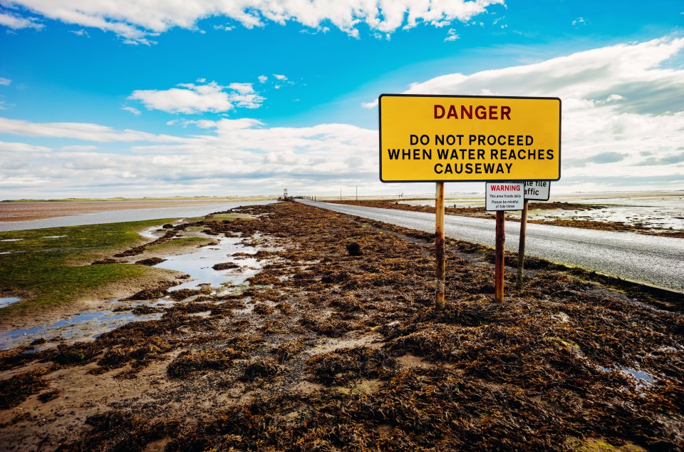 Holy Island is connected to the British mainland via a long causeway, which is only accessible when the tide is low