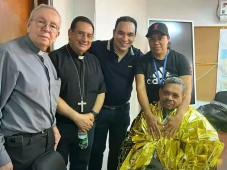 Diaz seen with members of the Catholic Church after his release