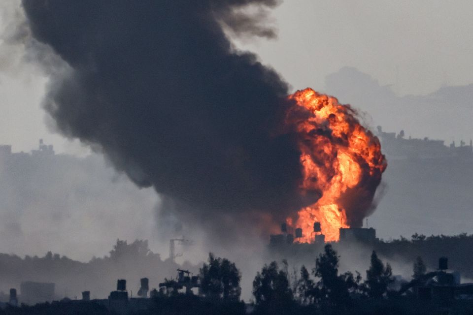 A fireball erupts in the Gaza Strip during Israeli bombardment