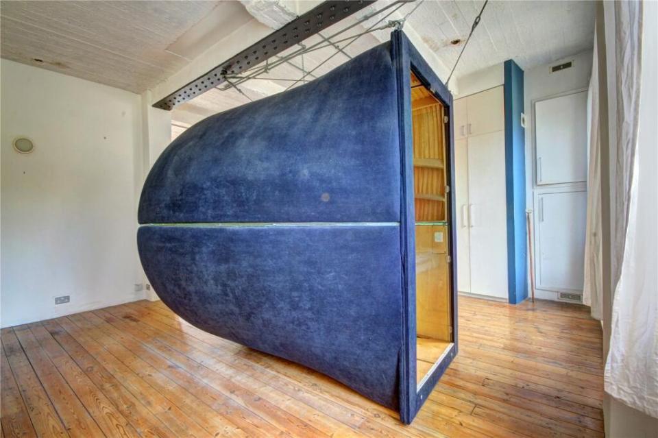 It can be found inside a fabric pod that hangs from the ceiling