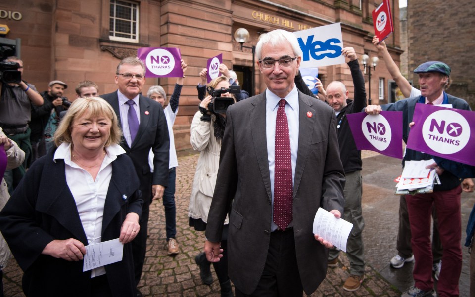 Alistair Darling and his wife Margaret Vaughan arriving to cast their votes in Scotland’s independence referendum in Edinburgh on September 18, 2014