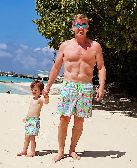 Gordon and his son Oscar don matching boardshorts on holiday in the Maldives