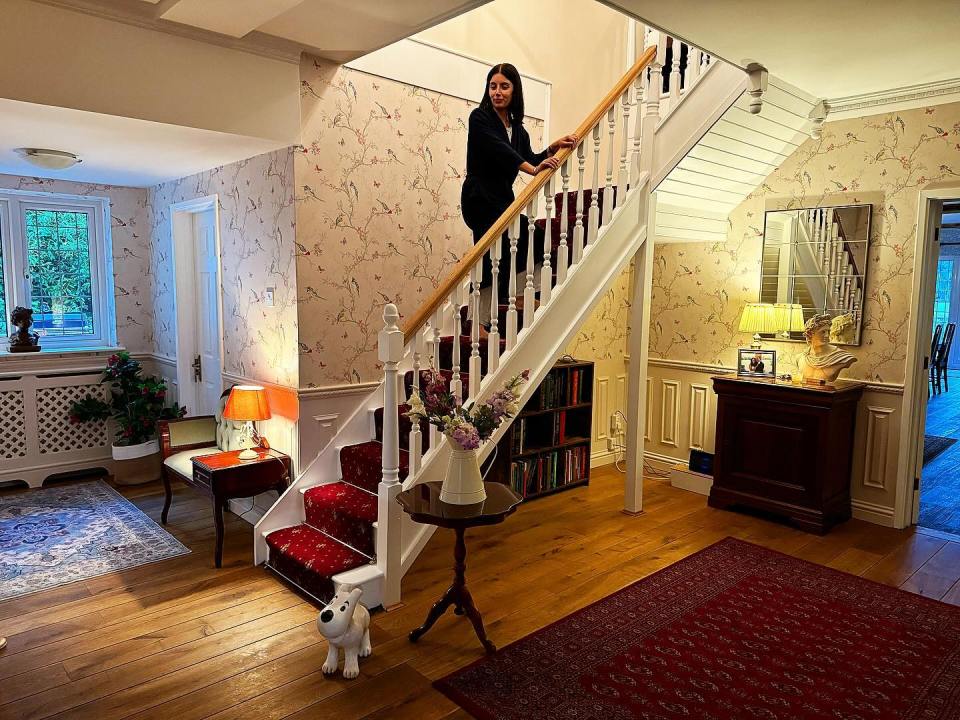 He captured wife Anna on the staircase in their re-vamped hallway