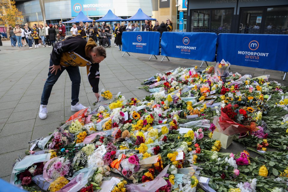 Devastated fans lay flowers at the Motorpoint Arena in Nottingham