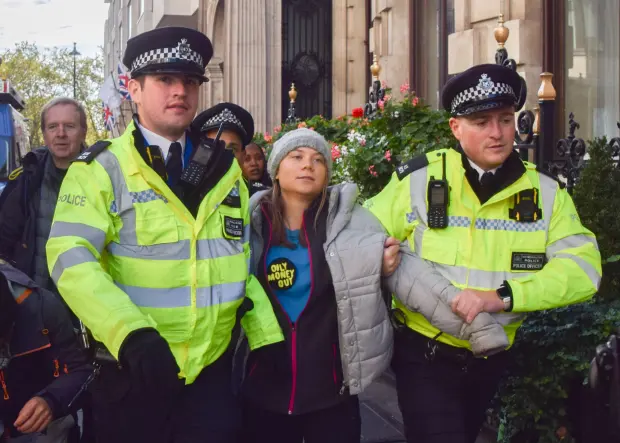 She was led away from the oil protest by police in October