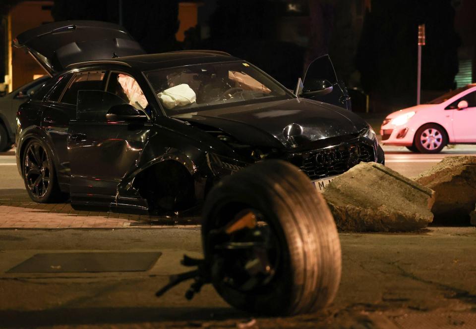 The car's wheel sheared off in the crash