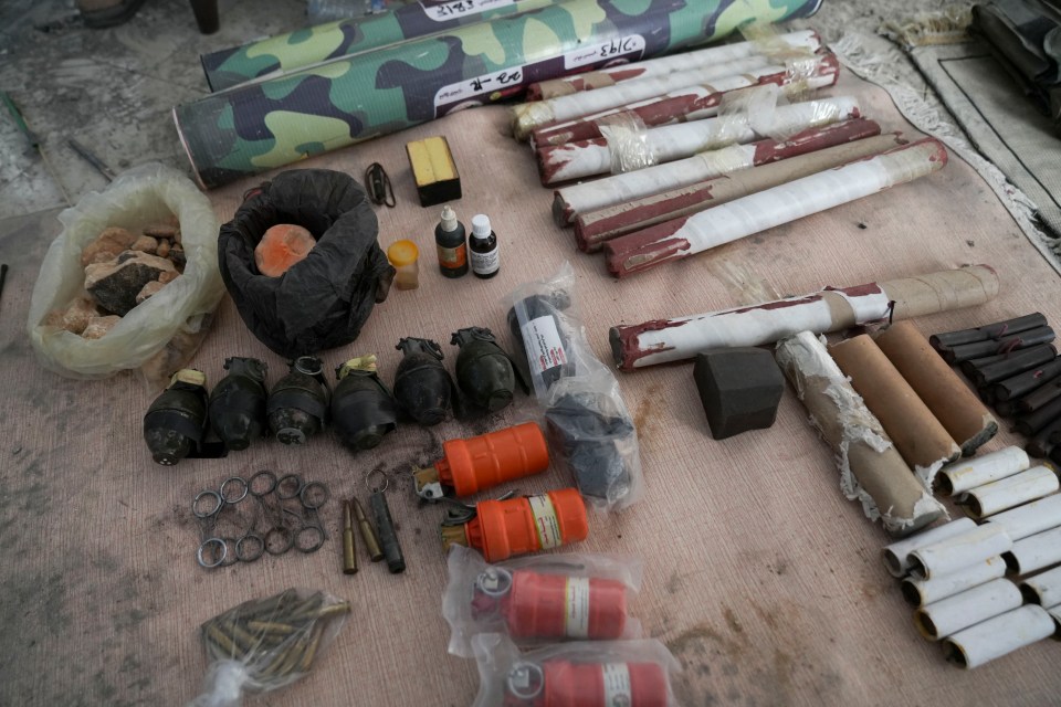 The Sun also saw rolled-up maps buried alongside hand grenades, rocket-propelled grenades, ammunition, TNT and explosive charges at the Hamas HQ