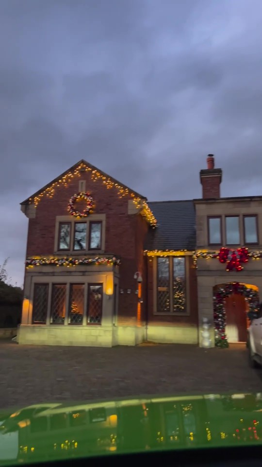 A glowing wreath takes pride of place on the main house