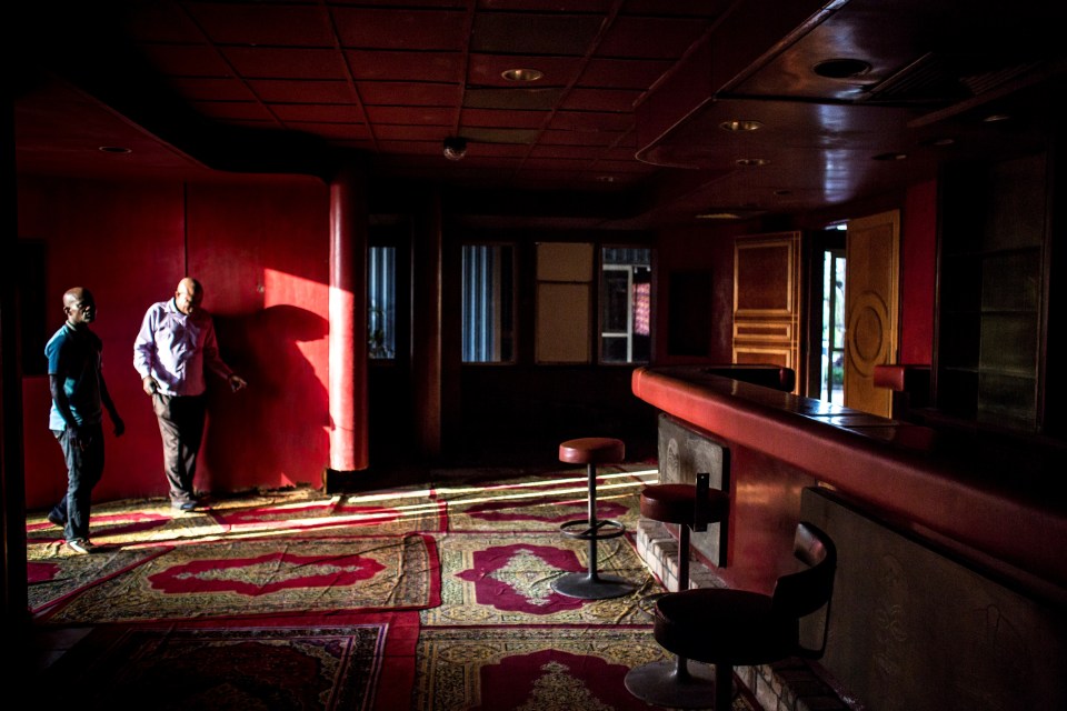 Mobutu's special red room that was used by a pope, presidents and wealthy businessmen to serve them drinks now just collects dust rather than serve alcohol