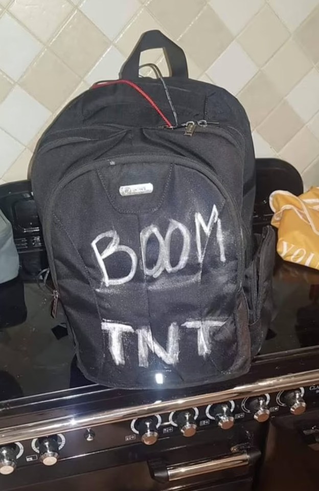 The outfit also included a black backpack with "BOOM TNT" written across it