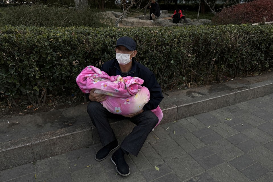 Hospitals have become so packed that some parents are having to sit outside with children