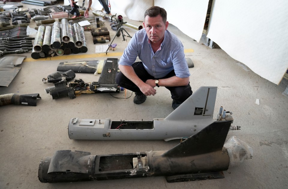 Sun man Paul Sims inspects the weapons arsenal including these deadly drones