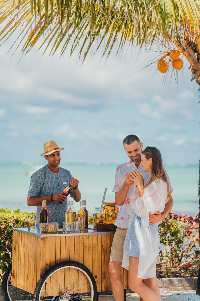 Stretch your legs on a ten-minute walk along the bay to one of the beach shacks in the centre of Grand Baie for a sunset drink