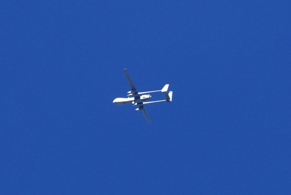 An unmanned military drone circles over the northern part of the Gaza Strip