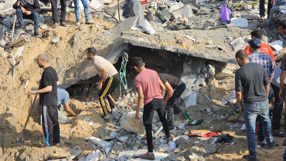 Palestinians looking for survivors in the rubble after the Israeli airstrikes