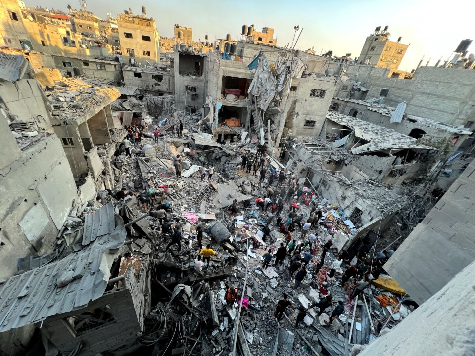 Palestinians search for casualties at the site of Israeli strikes on Jabalia refugee camp amid ongoing conflict at the Indonesian Hospital