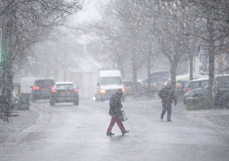 Snow falls in Guisborough, North Yorkshire, yesterday