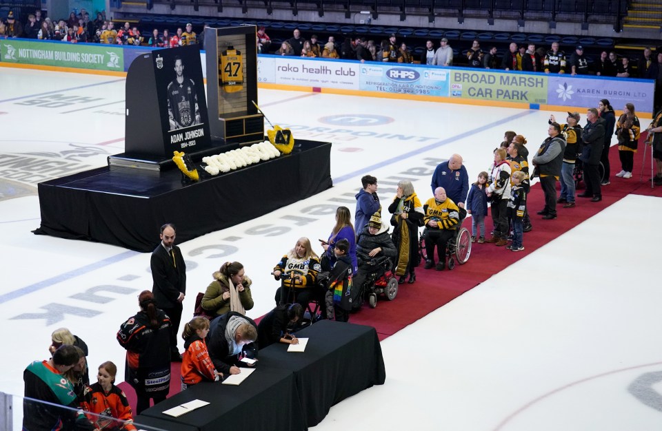 Fans gathered at the Panthers' Motorpoint Arena in Nottingham on Saturday to sign a book of condolence for Adam Johnson