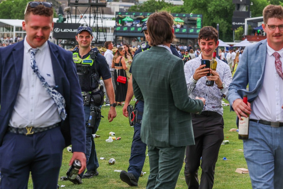 Two punters carried bottles of red wine round with them as the party got into full swing