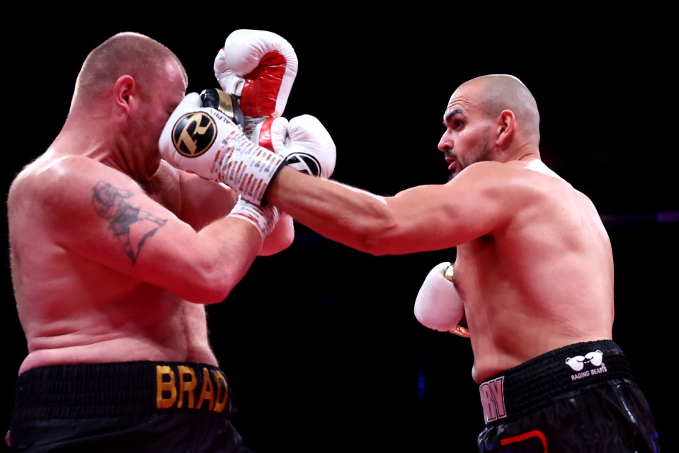 Roman punches Bradley Davies during the Cruiserweight fight