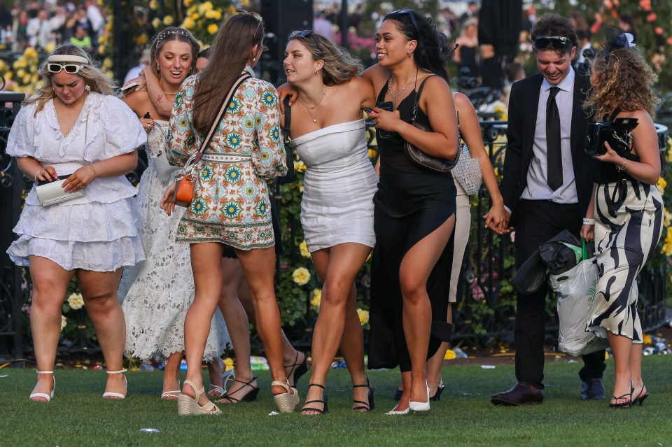 Racegoers leave Flemington racecourse after Victoria Derby Day