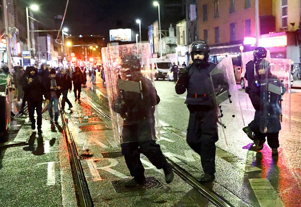 Gardai wearing riot gear were forced to try calm the chaos