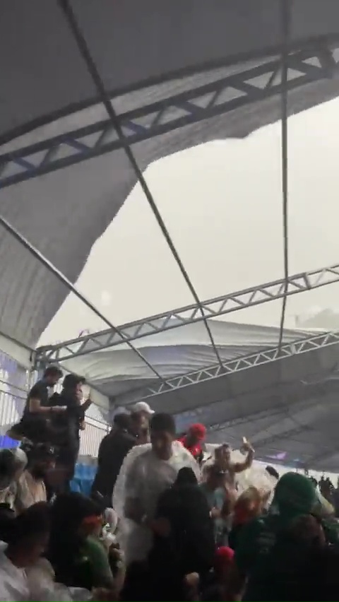 Terrified fans escaped as the grandstand's roof eventually collapsed