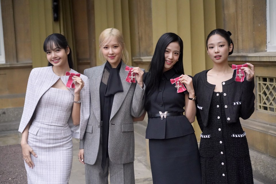 Blackpink show off their honorary MBEs at Buckingham Palace