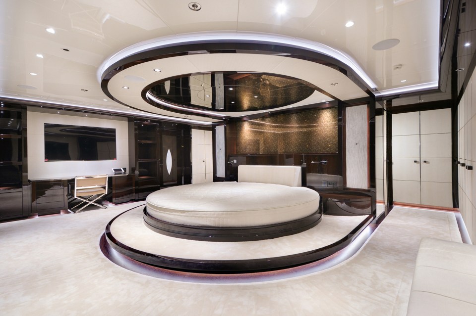 It features a circular bed with a ceiling mirror after a refit