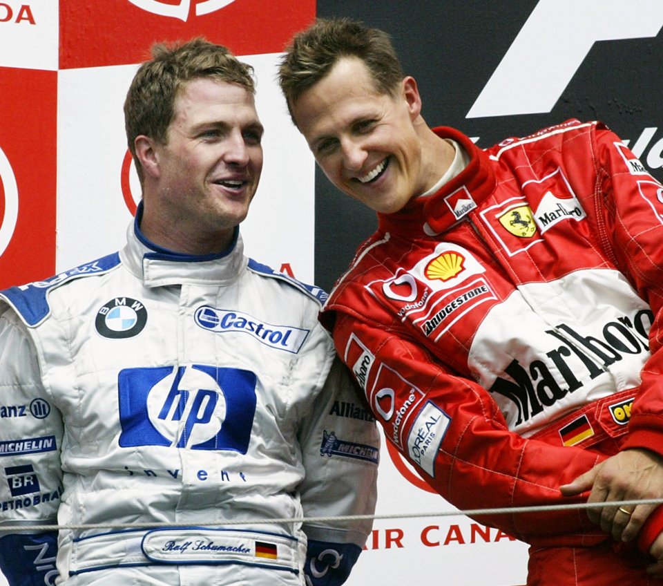 Michael Schumacher (right) having a laugh with Ralf (left) at the Canadian Grand Prix in 2003