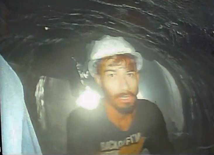 The first video of workers trapped inside a collapsed tunnel has emerged