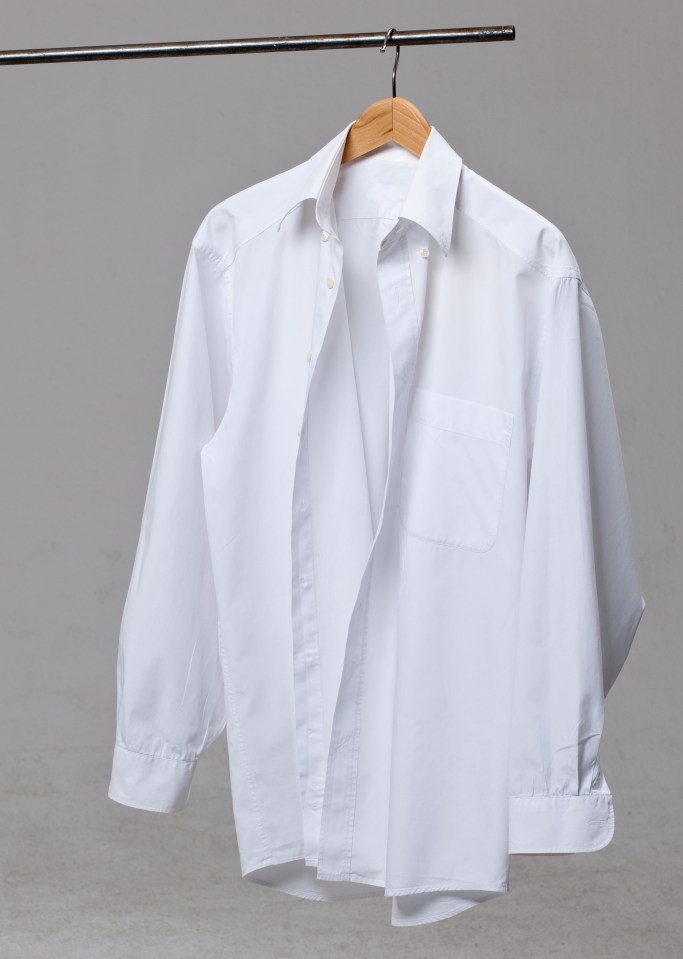 A white shirt on a coat hanger.; Shutterstock ID 1179137758; purchase_order: -; job: -; client: -; other: -