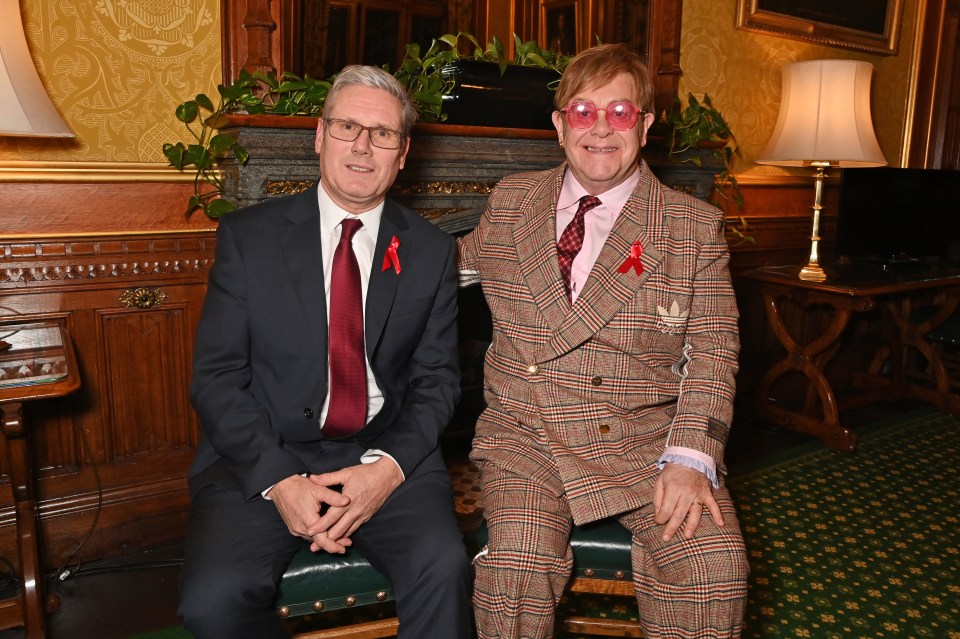 Sir Elton John posed at a Parliamentary reception with Sir Keir Starmer, who vowed to update his HIV Action Plan as soon as he comes to Government