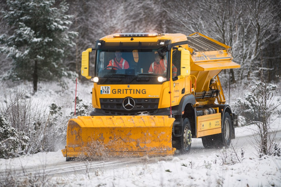 A snow plough is pictured battling the wintery conditions in North Yorkshire this morning