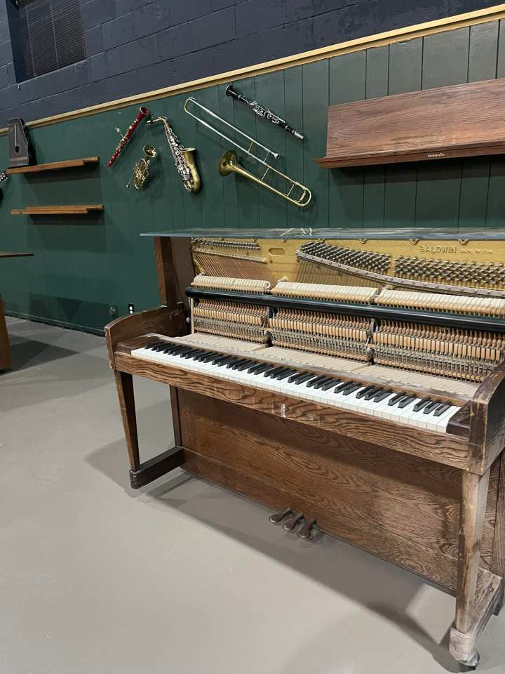 Musical instruments line the walls in the renovated school