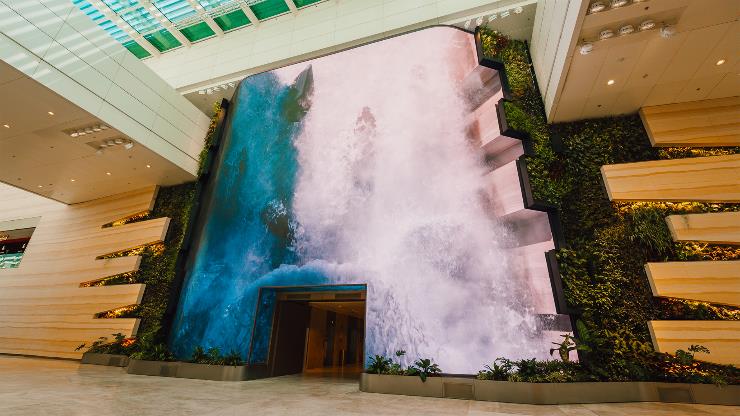 Inside is a digital waterfall surrounded by a vertical garden