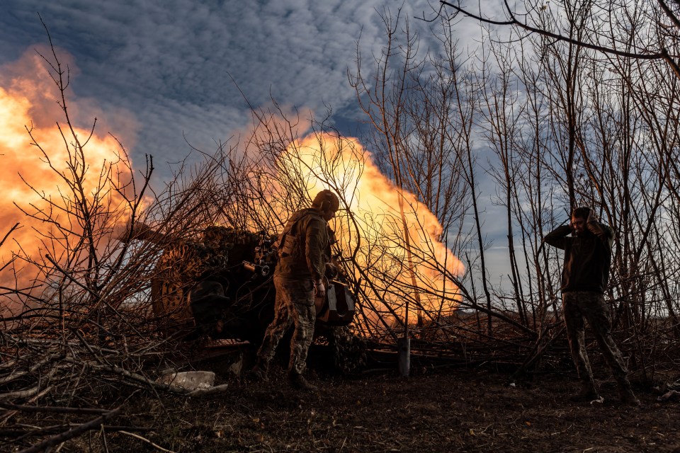 Ukrainian soldiers fire artillery in the direction of Bakhmut as the war continues