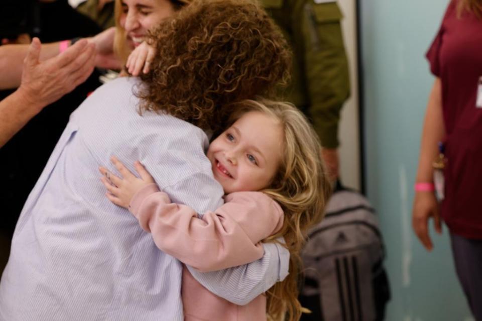 Five-year-old Emilia Aloni also returned to Israel last night after 7 weeks in captivity in Gaza, pictured here hugging her grandmother