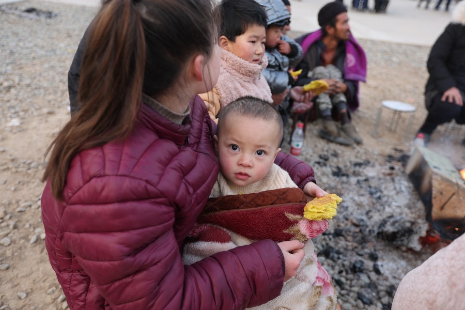 Survivors are now huddling in bitingly cold -13C temperatures