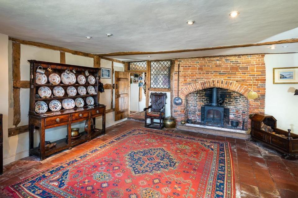 The property features an impressive fireplace