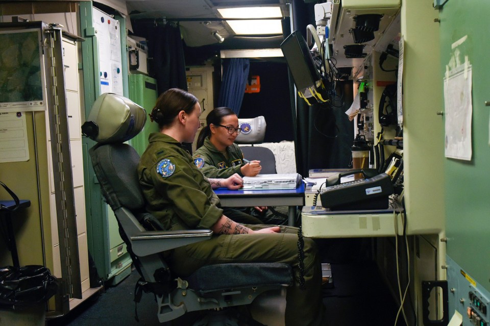 Two missile launch officers, or missileers, at a launch control centre at Malmstrom Air Force Base