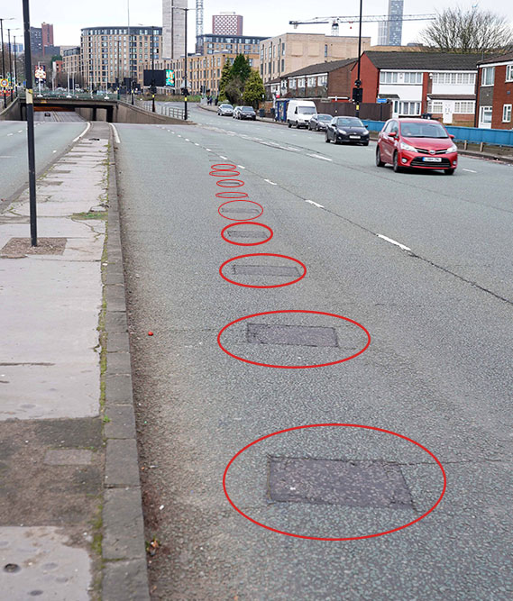 On Belgrade Middleway near Sherlock Street, several tarmac squares have been left on the road surface